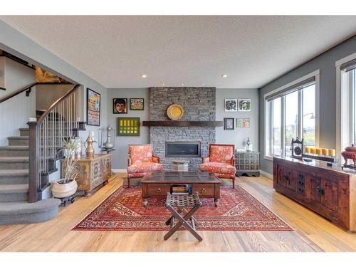 165 Aspen Summit Circle Sw, Calgary, AB - Indoor Photo Showing Living Room With Fireplace