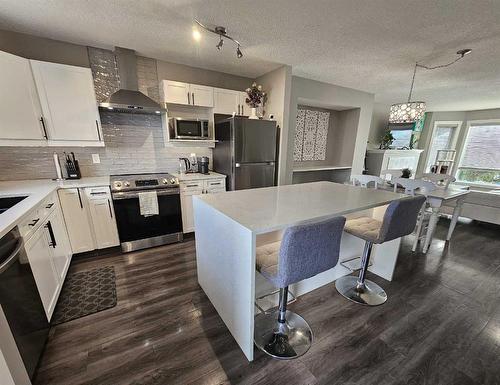 115 Cramond Green Se, Calgary, AB - Indoor Photo Showing Kitchen With Double Sink With Upgraded Kitchen