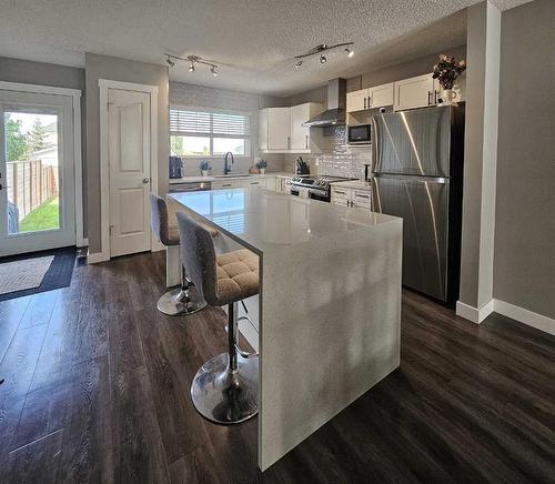 115 Cramond Green Se, Calgary, AB - Indoor Photo Showing Kitchen With Upgraded Kitchen