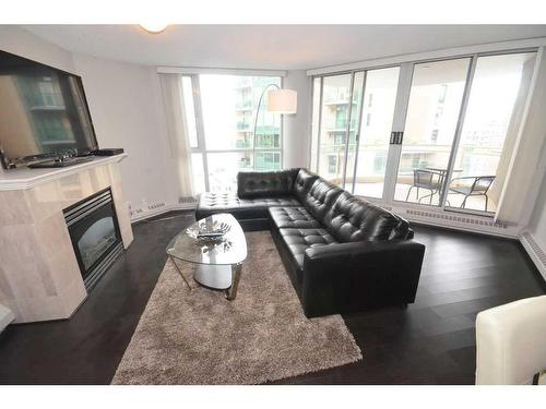 1101-804 3 Avenue Sw, Calgary, AB - Indoor Photo Showing Living Room With Fireplace