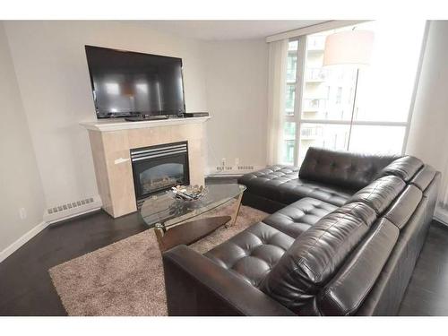 1101-804 3 Avenue Sw, Calgary, AB - Indoor Photo Showing Living Room With Fireplace