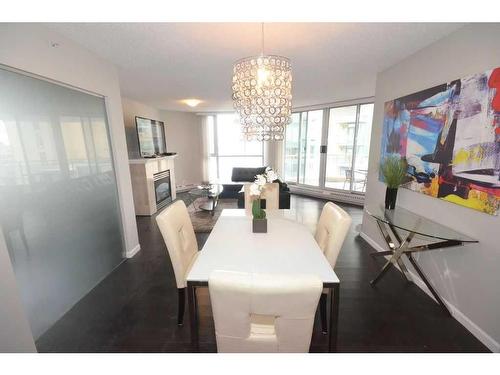 1101-804 3 Avenue Sw, Calgary, AB - Indoor Photo Showing Dining Room With Fireplace