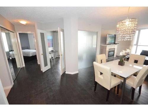 1101-804 3 Avenue Sw, Calgary, AB - Indoor Photo Showing Dining Room With Fireplace