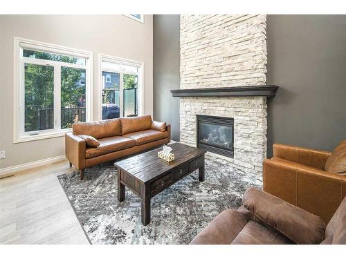 35 Aspen Summit Mount Sw, Calgary, AB - Indoor Photo Showing Living Room With Fireplace