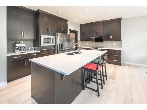 35 Aspen Summit Mount Sw, Calgary, AB - Indoor Photo Showing Kitchen With Stainless Steel Kitchen With Double Sink With Upgraded Kitchen