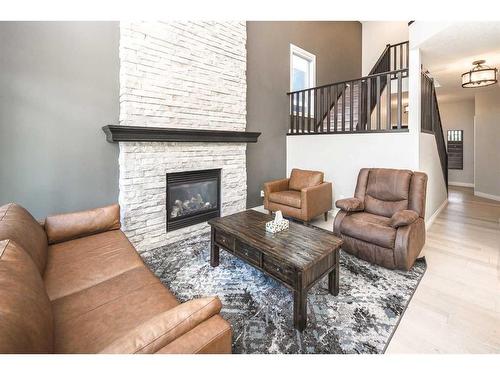 35 Aspen Summit Mount Sw, Calgary, AB - Indoor Photo Showing Living Room With Fireplace