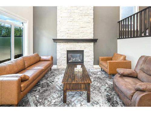 35 Aspen Summit Mount Sw, Calgary, AB - Indoor Photo Showing Living Room With Fireplace