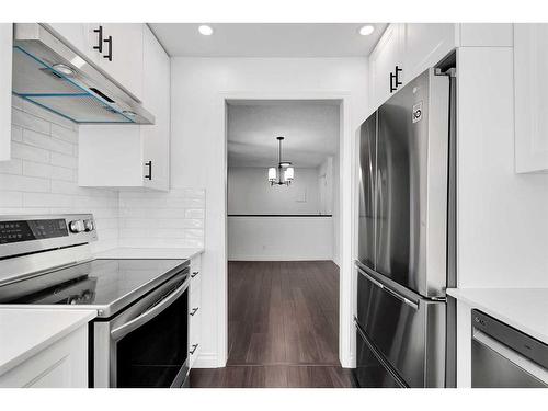 303-3719C 49 Street Nw, Calgary, AB - Indoor Photo Showing Kitchen With Stainless Steel Kitchen