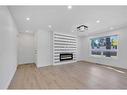 5512 Silverdale Drive Nw, Calgary, AB  - Indoor Photo Showing Living Room With Fireplace 