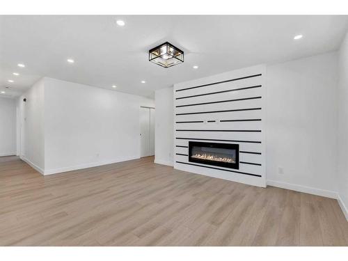 5512 Silverdale Drive Nw, Calgary, AB - Indoor Photo Showing Living Room With Fireplace