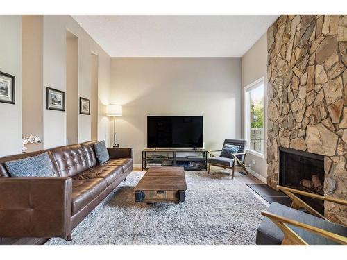 5-99 Midpark Gardens Se, Calgary, AB - Indoor Photo Showing Living Room With Fireplace