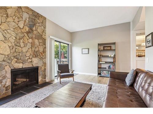 5-99 Midpark Gardens Se, Calgary, AB - Indoor Photo Showing Living Room With Fireplace