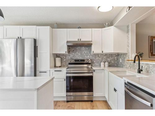 5-99 Midpark Gardens Se, Calgary, AB - Indoor Photo Showing Kitchen With Stainless Steel Kitchen With Upgraded Kitchen