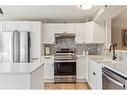 5-99 Midpark Gardens Se, Calgary, AB  - Indoor Photo Showing Kitchen With Stainless Steel Kitchen With Upgraded Kitchen 