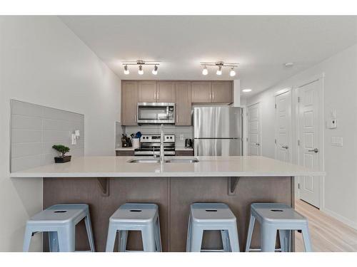 412-338 Seton Circle Se, Calgary, AB - Indoor Photo Showing Kitchen