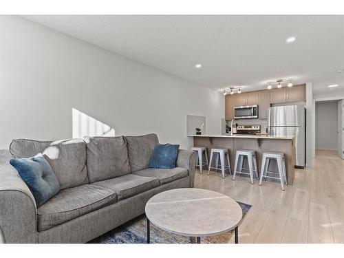 412-338 Seton Circle Se, Calgary, AB - Indoor Photo Showing Living Room