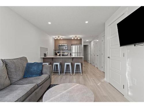 412-338 Seton Circle Se, Calgary, AB - Indoor Photo Showing Living Room