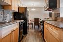 301-1312 13 Avenue Sw, Calgary, AB  - Indoor Photo Showing Kitchen With Double Sink 