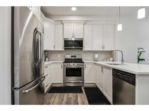 417 Carringvue Avenue Nw, Calgary, AB - Indoor Photo Showing Kitchen With Stainless Steel Kitchen With Upgraded Kitchen