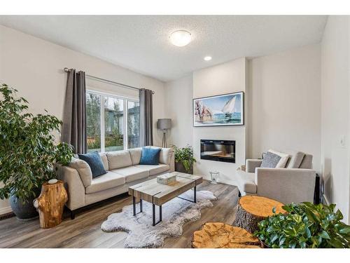 417 Carringvue Avenue Nw, Calgary, AB - Indoor Photo Showing Living Room With Fireplace