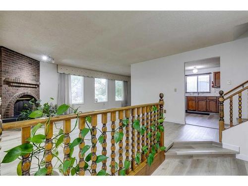 6732 Temple Drive Ne, Calgary, AB - Indoor Photo Showing Other Room With Fireplace