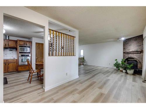 6732 Temple Drive Ne, Calgary, AB - Indoor With Fireplace