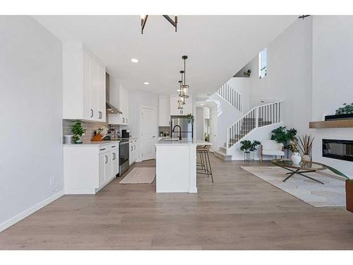 28 Walcrest Row Se, Calgary, AB - Indoor Photo Showing Kitchen With Fireplace