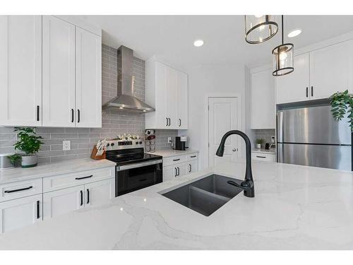 28 Walcrest Row Se, Calgary, AB - Indoor Photo Showing Kitchen With Double Sink With Upgraded Kitchen