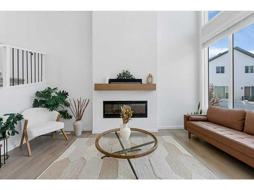 28 Walcrest Row Se, Calgary, AB - Indoor Photo Showing Living Room With Fireplace