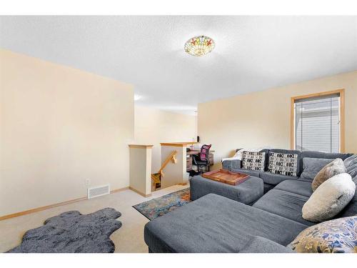 209 Tuscany Ravine Road Nw, Calgary, AB - Indoor Photo Showing Living Room