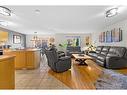 209 Tuscany Ravine Road Nw, Calgary, AB  - Indoor Photo Showing Living Room 