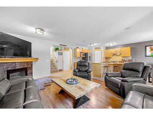 209 Tuscany Ravine Road Nw, Calgary, AB - Indoor Photo Showing Living Room With Fireplace