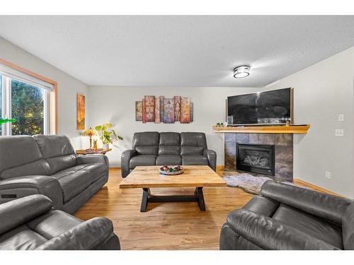 209 Tuscany Ravine Road Nw, Calgary, AB - Indoor Photo Showing Living Room With Fireplace