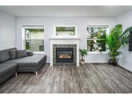 134 Country Hills Villas Nw, Calgary, AB - Indoor Photo Showing Living Room With Fireplace