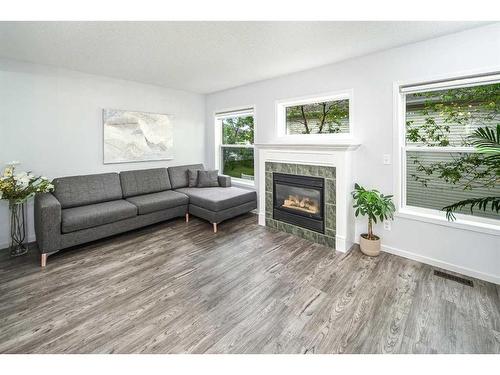 134 Country Hills Villas Nw, Calgary, AB - Indoor Photo Showing Living Room With Fireplace