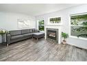 134 Country Hills Villas Nw, Calgary, AB  - Indoor Photo Showing Living Room With Fireplace 