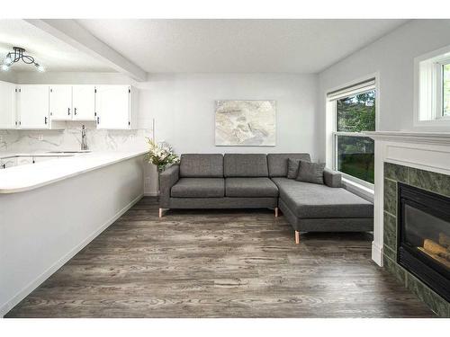 134 Country Hills Villas Nw, Calgary, AB - Indoor Photo Showing Living Room With Fireplace