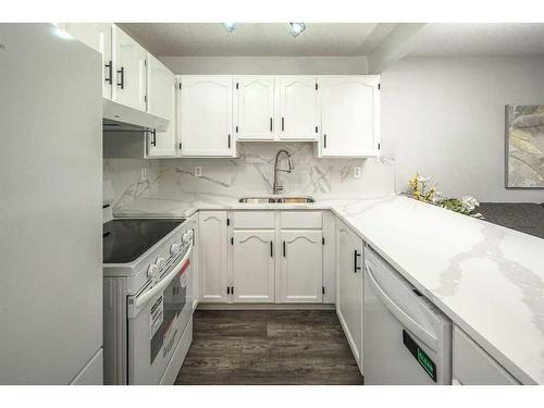 134 Country Hills Villas Nw, Calgary, AB - Indoor Photo Showing Kitchen With Double Sink