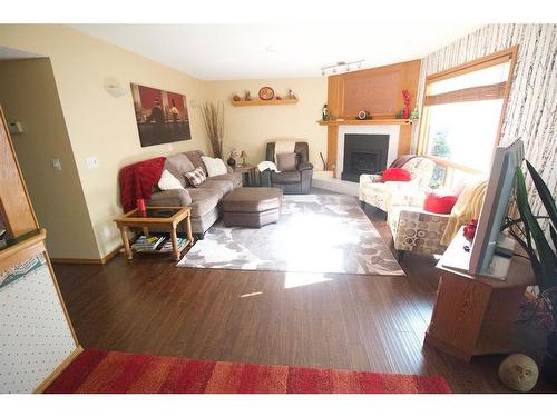 25 Arbour Summit Close Nw, Calgary, AB - Indoor Photo Showing Living Room With Fireplace