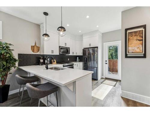 1923 19 Avenue Nw, Calgary, AB - Indoor Photo Showing Kitchen With Double Sink With Upgraded Kitchen