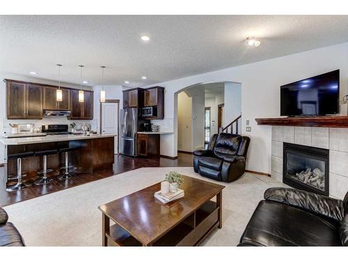 217 Elgin Manor Se, Calgary, AB - Indoor Photo Showing Living Room With Fireplace