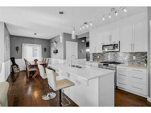 288 Rainbow Falls Green, Chestermere, AB - Indoor Photo Showing Kitchen With Double Sink With Upgraded Kitchen