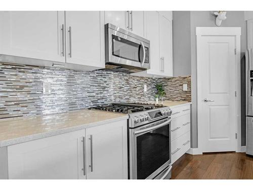 288 Rainbow Falls Green, Chestermere, AB - Indoor Photo Showing Kitchen With Upgraded Kitchen