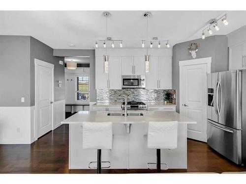 288 Rainbow Falls Green, Chestermere, AB - Indoor Photo Showing Kitchen With Stainless Steel Kitchen With Double Sink With Upgraded Kitchen