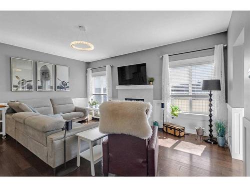 288 Rainbow Falls Green, Chestermere, AB - Indoor Photo Showing Living Room With Fireplace