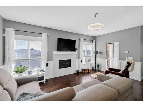 288 Rainbow Falls Green, Chestermere, AB - Indoor Photo Showing Living Room With Fireplace