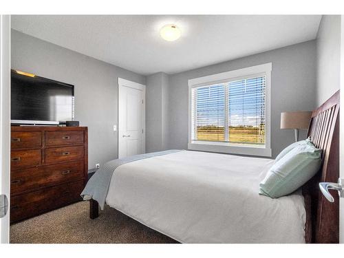 288 Rainbow Falls Green, Chestermere, AB - Indoor Photo Showing Bedroom