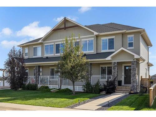 288 Rainbow Falls Green, Chestermere, AB - Outdoor With Deck Patio Veranda With Facade