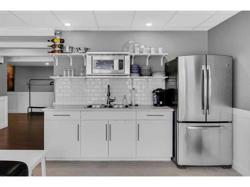 288 Rainbow Falls Green, Chestermere, AB - Indoor Photo Showing Kitchen With Double Sink