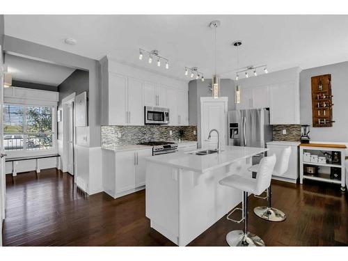 288 Rainbow Falls Green, Chestermere, AB - Indoor Photo Showing Kitchen With Double Sink With Upgraded Kitchen